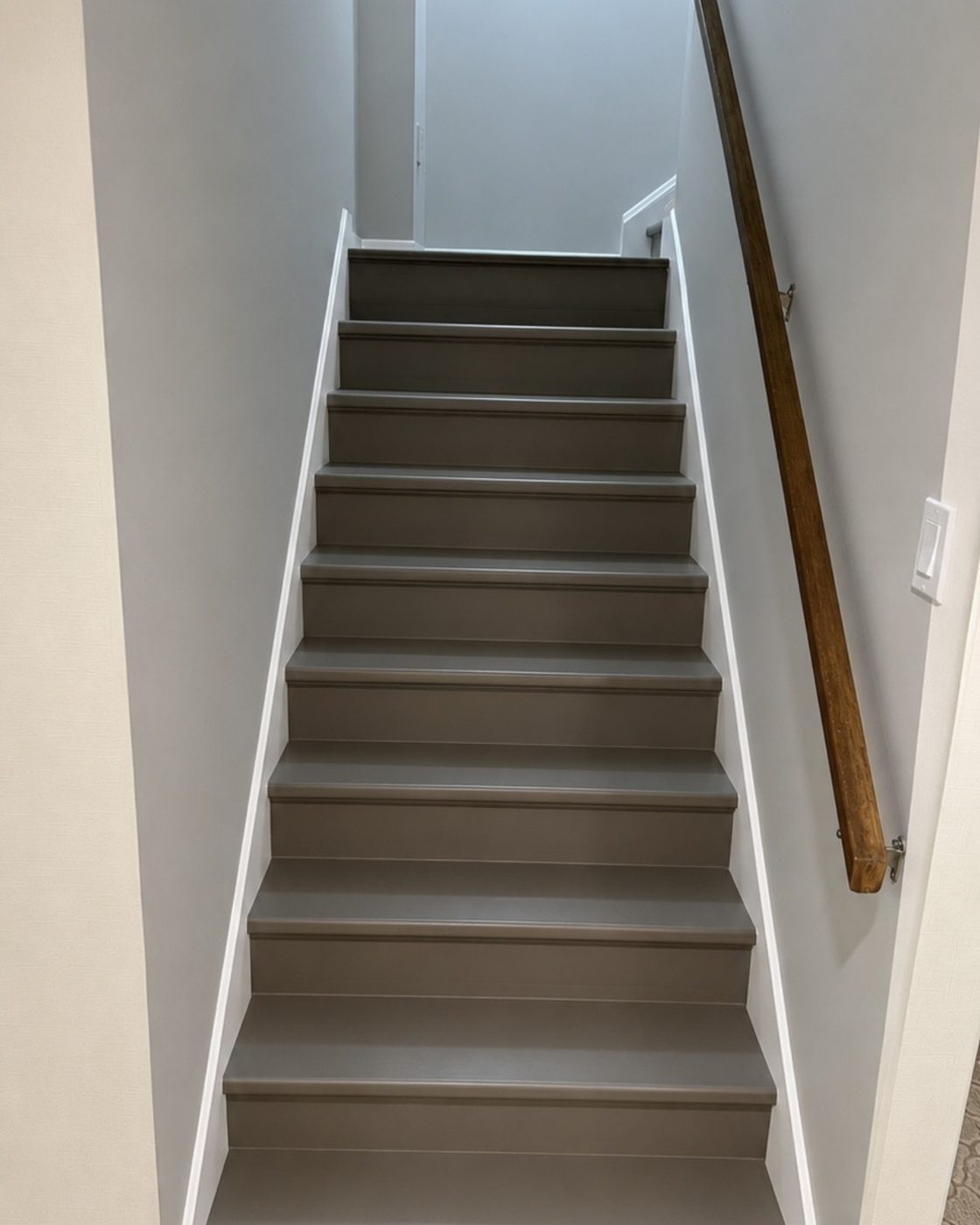 Staircase after painting, smooth grey painted treads and risers