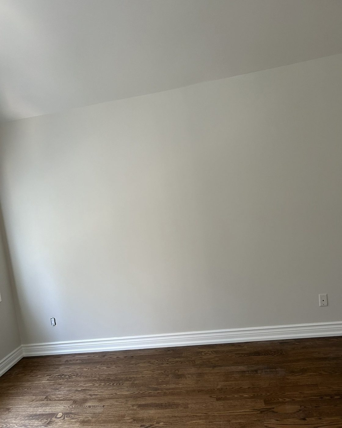 Wall after, smooth painted finish with wallpaper fully removed